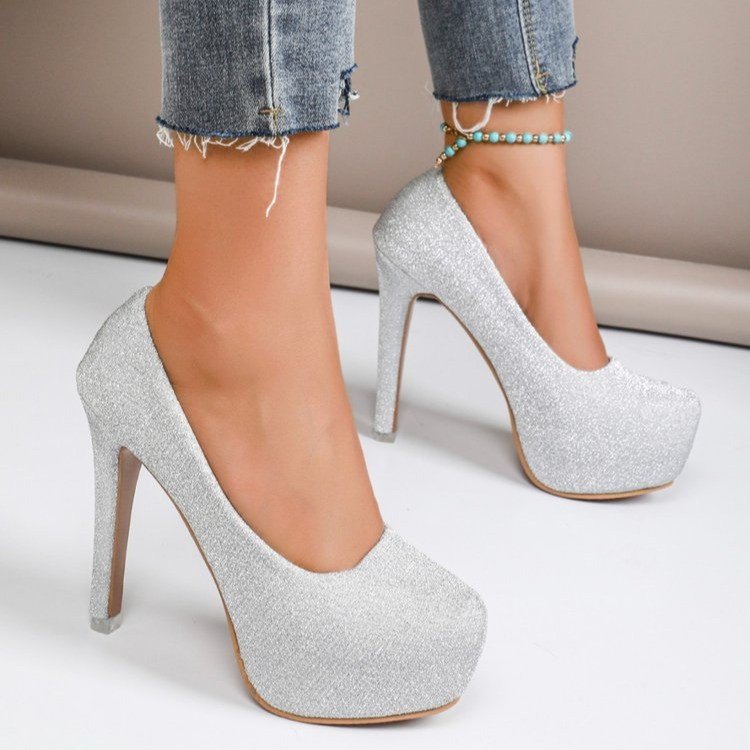 “Glam Game Strong” – Patent Stilettos for Everyday Icons