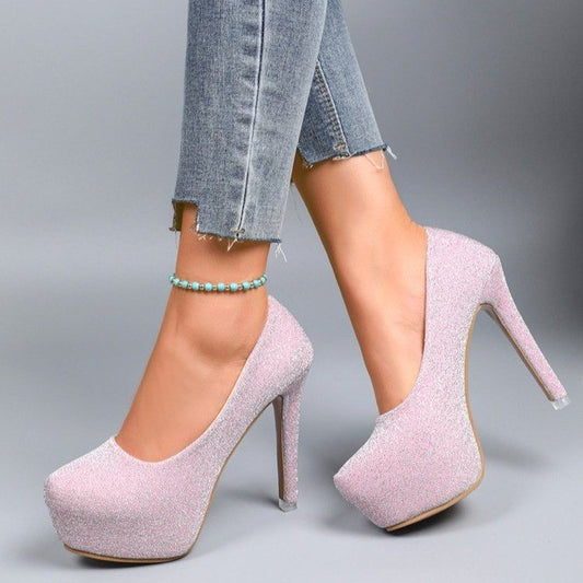 “Glam Game Strong” – Patent Stilettos for Everyday Icons